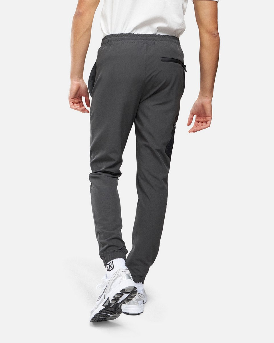 FootKorner TestingPantalon jogging Helvetica Terra - Gris