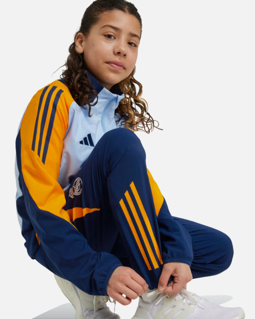 FootKorner TestingPantalon de survêtement Real Madrid Junior 2024/2025 - Bleu/Orange