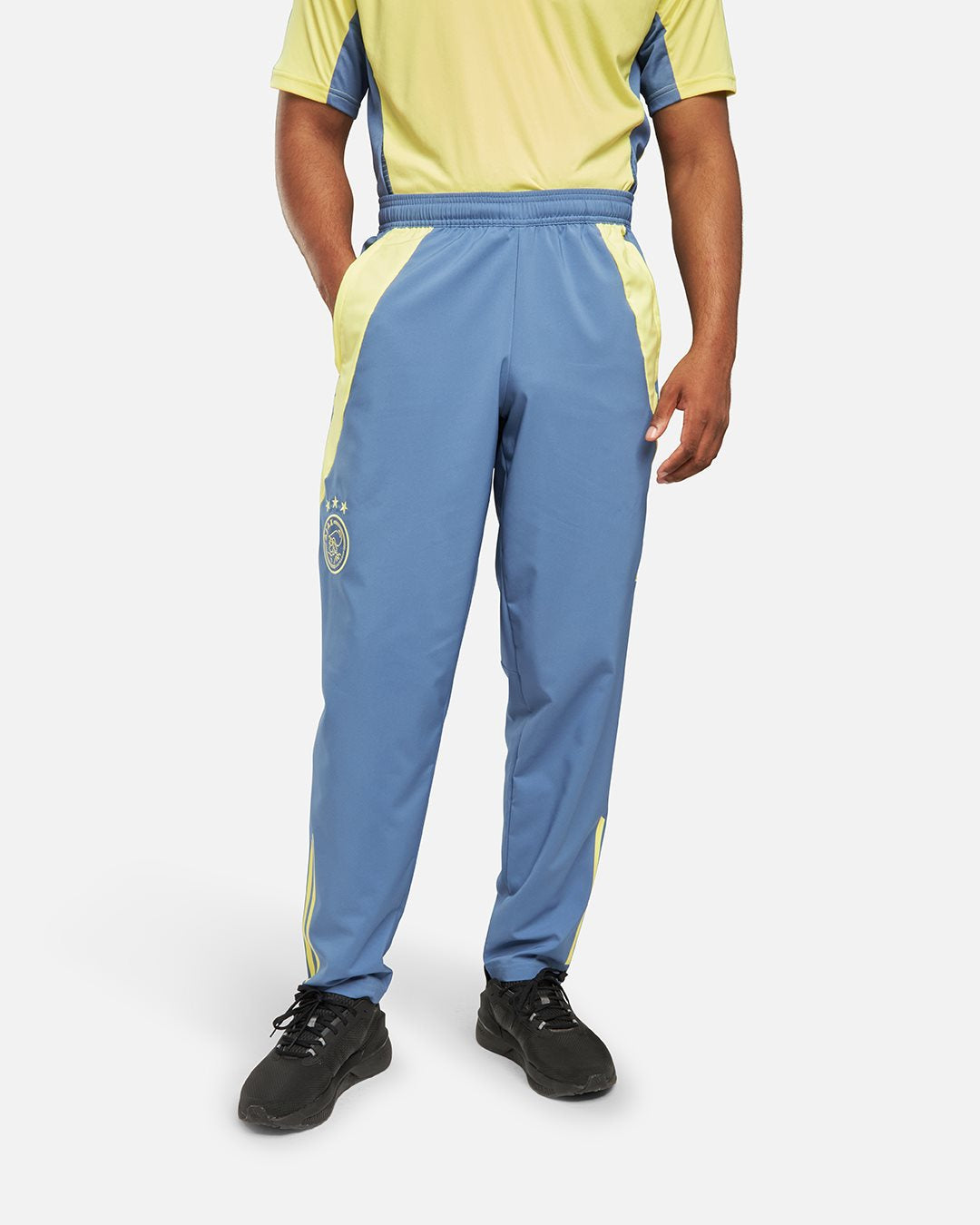 FootKorner TestingPantalon de survêtement Ajax Amsterdam 2024/2025 - Bleu/Jaune