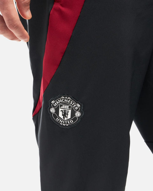 Pantalon de survêtement Manchester United 2024/2025 - Noir/Rouge - FootKorner Testing