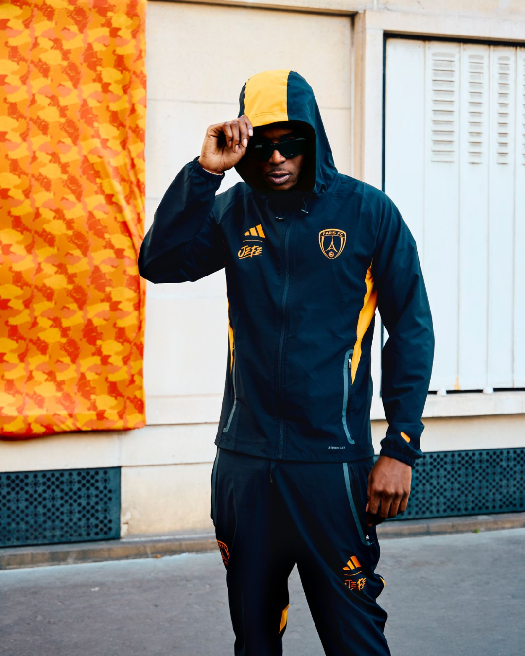 FootKorner TestingVeste de survêtement Paris FC x Jefe - Noir/Orange